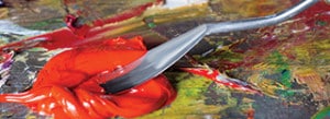 Picture of a palette knife working in red Michael Harding oil paint