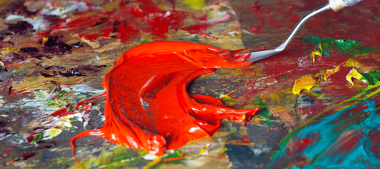 Creative shot of palette knife with Michael Harding oil paint